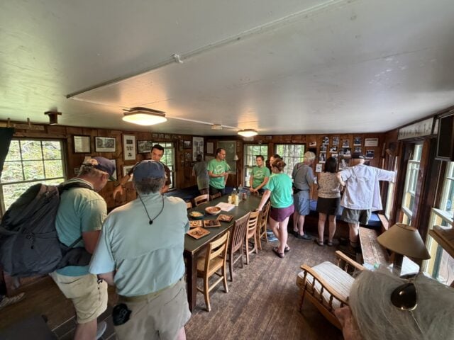guests gather inside the cabin